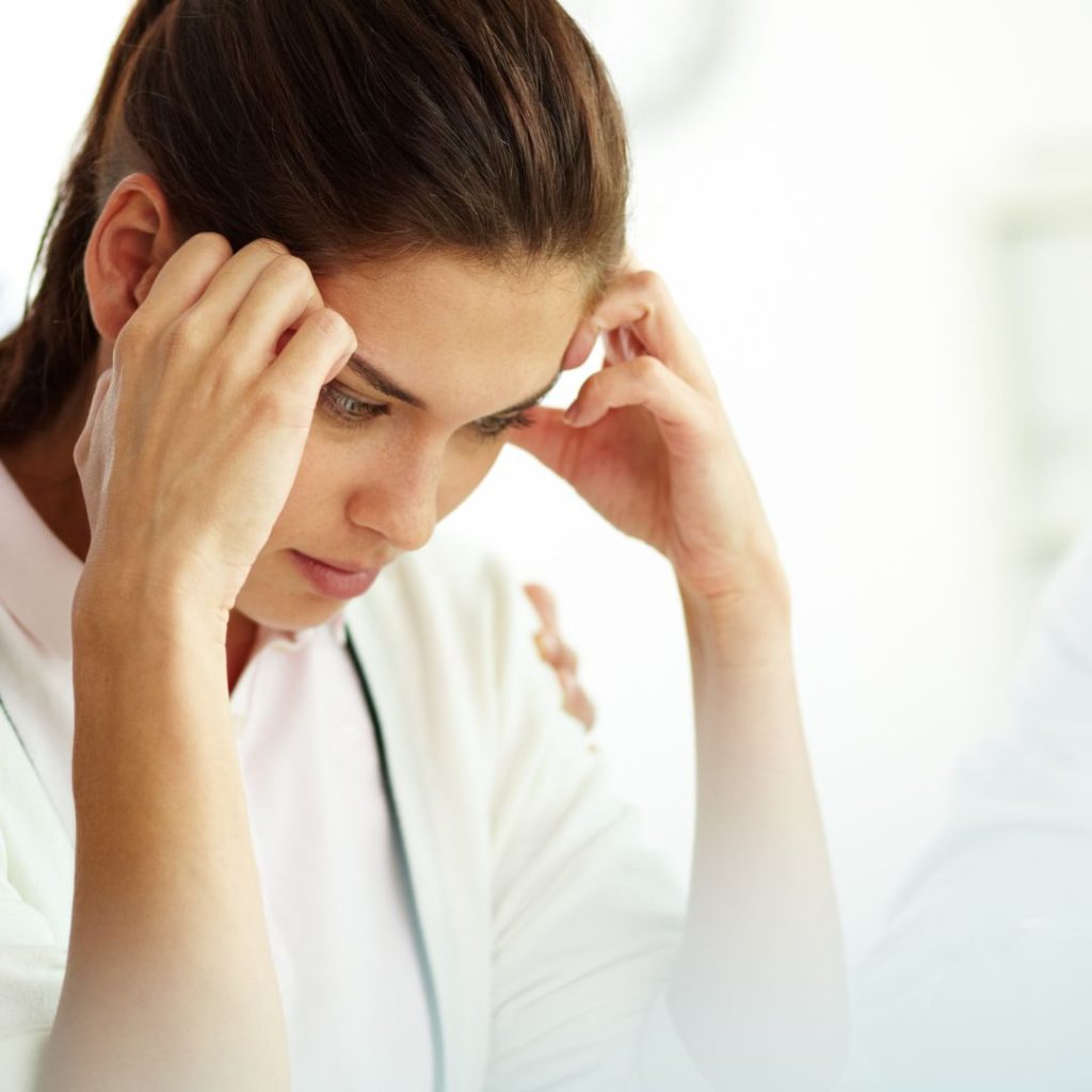 lady suffering with migraine