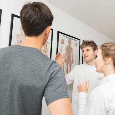 osteopath during patient consultation